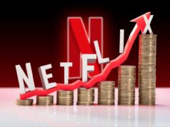 O último aumento de preços da Netflix destaca o que há de errado com o streaming Logotipo Tubi amarelo em um fundo roxo com pôsteres de filmes desfocados.