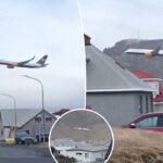 Avião voando baixo sobre a cidade.