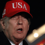 President Donald Trump speaks the the media after disembarking from Air Force One on April 12, 2026 at Joint Base Andrews, Maryland.