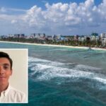 Um jovem de cabelos escuros vestindo uma camisa branca.