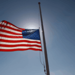 File image: A flag flies at half staff at the Mt. Soledad National War Memorial on August 27, 2021 in La Jolla, California.
