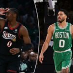 Tyrese Maxey comemora sua cesta de três pontos levantando três dedos, enquanto é defendido por Hugo Gonzalez.