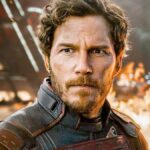 A man looks defiant with an explosion in the background