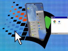 Transformei meu telefone de US$ 1.000 em um computador desktop de 1995 com este peculiar iniciador de Android Mascote do Android entre caixas de papelão etiquetadas para aplicativos, capturas de tela, notificações e distrações, em frente à tela de um smartphone, com uma vassoura apoiada nas caixas.