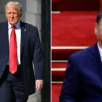 Donald Trump em terno azul marinho e gravata vermelha andando ao ar livre.