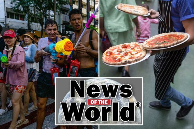 Foliões participando de lutas pela água durante o festival Songkran em Bangkok.