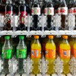 Caixa de suco de frutas cítricas Five Alive com imagens de frutas cítricas.