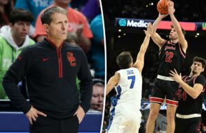 A escalação de basquete masculino da USC pode ficar completa com a adição de Isaac Bruns Um jogador de basquete com uniforme preto e vermelho atirando um arremesso sobre um jogador adversário.