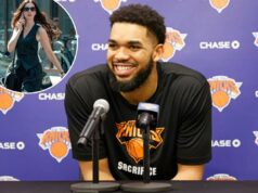 A participação especial de Karl-Anthony Towns em ‘The Devil Wears Prada 2’ foi ‘uma honra’ Karl-Anthony Towns sorrindo em uma coletiva de imprensa com dois microfones à sua frente.