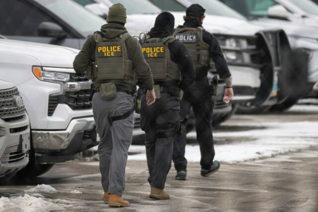 ICE agents depart the Bishop Henry Whipple Federal Building on February 4, 2026, in Minneapolis.