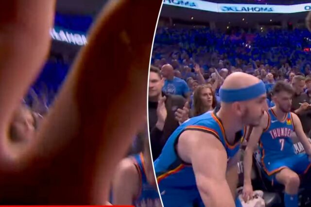 Alex Caruso tira a câmera do rosto durante o momento Alex Caruso afastando uma câmera de um grupo de basquete.