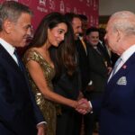 Amal Clooney shakes King Charles III's hand alongside husband George Clooney at 'A King's Trust 50th Anniversary Celebration' at the Royal Albert Hall, in London, England, on May 11, 2026.