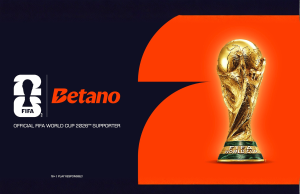 Betano expande presença na Copa do Mundo FIFA por meio de nova parceria no torneio de 2026 Anúncio do patrocinador Betano da Copa do Mundo FIFA 2026 com a marca oficial do torcedor do torneio ao lado do troféu da Copa do Mundo FIFA em fundo laranja.