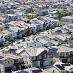 An aerial view shows homes with solar panels in a housing development on April 7 in Santa Clarita, California.