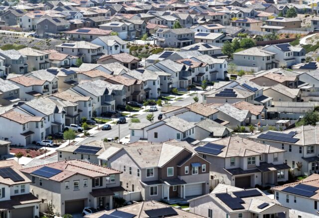 An aerial view shows homes with solar panels in a housing development on April 7 in Santa Clarita, California.