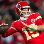 KANSAS CITY, MISSOURI - DECEMBER 07: Patrick Mahomes #15 of the Kansas City Chiefs warms up prior to an NFL football game against the Houston Texans at GEHA Field at Arrowhead Stadium on December 7, 2025 in Kansas City, Missouri. (Photo by Cooper Neill/Getty Images)