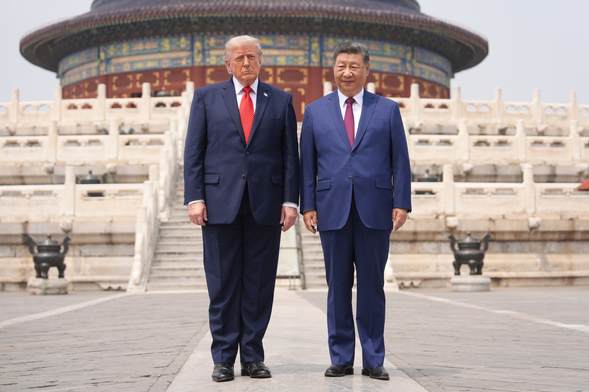 U.S. President Donald Trump, left, stands with Chinese President Xi Jinping at the Temple of Heaven on May 14 in Beijing.