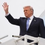 President Donald Trump waves as he boards Air Force One, Friday, May 15, 2026, at Beijing Capital International Airport in Beijing. (AP Photo/Mark Schiefelbein)