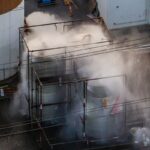 An aerial view of water being sprayed onto an overheated 34,000-gallon tank at GKN Aerospace on May 23, 2026 in Garden Grove, California.