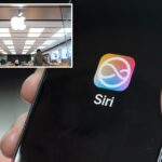 Uma mão segurando um iPhone exibindo o logotipo Siri AI.