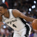 SAN ANTONIO, TEXAS - MAY 24:  De'aaron Fox #4 of the San Antonio Spurs handles the ball against the Oklahoma City Thunder during the third quarter in Game Four of the NBA Western Conference Finals at Frost Bank Center on May 24, 2026 in San Antonio, Texas. (Photo by Alex Slitz/Getty Images)