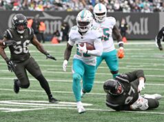 De’Von Achane obtém extensão de quatro anos no valor de até US$ 68 milhões em grande impulso para Dolphins O running back dos Dolphins, De'Von Achane (28), corre a bola para um touchdown durante o primeiro quarto no jogo Jets e Miami Dolphins em East Rutherford, NJ.