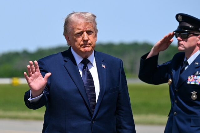 U.S. President Donald Trump waves as he departs Air Force One at Morristown Airport for a campaign and economic policy event at SUNY Rockland Community College on May 22, 2026 in Morristown, New Jersey.