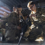Members of the 82nd Airborne Division of the U.S. Army clean weaponry ahead of deployment to Poland from Fort Bragg, North Carolina on February 14, 2022.