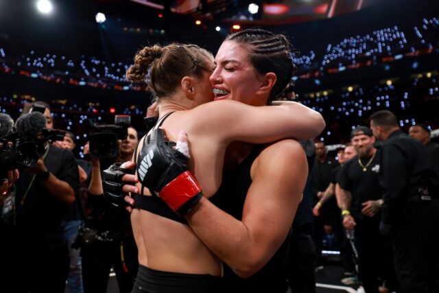 Ronda Rousey and Gina Carano hug after their MVP MMA main event fight on Netflix