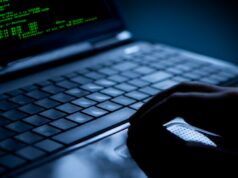Hackers hackeiam vítimas hackeadas por outros hackers Hacker using laptop. Lots of digits on the computer screen.