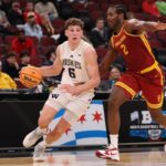 CHICAGO, ILLINOIS - MARCH 11: Hannes Steinbach #6 of the Washington Huskies drives to the basket against Ezra Ausar #2 of the USC Trojans in the first half during the second round of the 2026 Big Ten Men's Basketball Tournament at the United Center on March 11, 2026 in Chicago, Illinois.  (Photo by Michael Reaves/Getty Images)