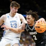 Jadrian Tracey #2 of the VCU Rams drives the ball against Henri Veesaar #13 of the North Carolina