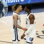 Dois jogadores do Memphis Grizzlies, Desmond Bane e Jaren Jackson Jr., conversando na quadra durante o sexto jogo da série Minnesota Timberwolves.