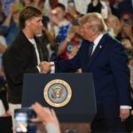 NFL quarterback Jaxson Dart, with the New York Giants introduces President Donald Trump during a