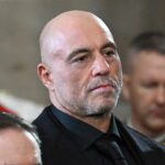 Joe Rogan stands for a benediction after President Donald Trump was sworn in at the U.S. Capitol in Washington, D.C., on January 20, 2025. (Saul Loeb/pool photo via AP, File)