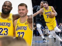 Luka Doncic, do Lakers, nomeado para o time All-NBA, recebendo honras de primeiro time Jogador do Los Angeles Lakers com camisa amarela driblando um jogador do Brooklyn Nets com camisa preta.