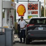 A person fills their car at a Shell gas station in Mount Prospect, Illinois, on May 21, 2026.