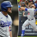 Max Muncy, do Los Angeles Dodgers, reage após ser atingido por um arremesso.