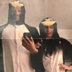 Harry e Meghan em seus macacões de pinguim combinando.