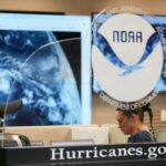 NOAA Corps officer Cara Geiger monitors weather at the National Hurricane Center on August 14, 2025, in Miami. (AP Photo/Lynne Sladky)