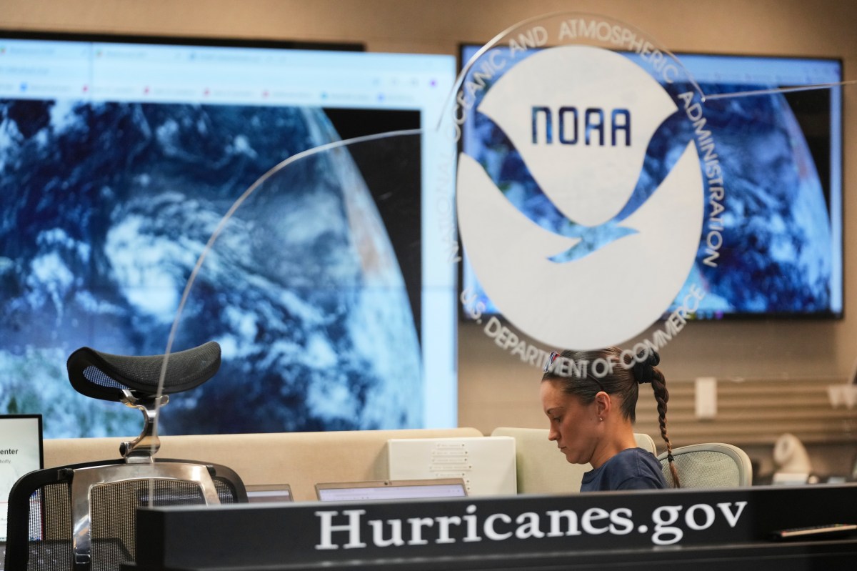 NOAA Corps officer Cara Geiger monitors weather at the National Hurricane Center on August 14, 2025, in Miami. (AP Photo/Lynne Sladky)