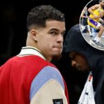 O jogador do Brooklyn Nets, Michael Porter Jr., no banco durante um jogo.