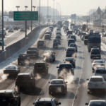 File photo: Multiple lanes of traffic crawl slowly on southbound Interstate-25 in Denver, Colorado, as exhaust fumes rise into the air on December 6, 2013.