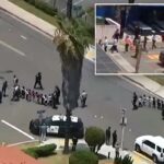 Momento aterrorizante, crianças pequenas evacuadas da mesquita de San Diego em meio a tiroteios
