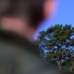 A Bundeswehr soldier observes a drone during a demonstration on April 30 in Lower Saxony, Munster. (Photo by: Philipp Schulze/picture-alliance/dpa/AP Images).