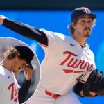 O arremessador do Minnesota Twins, Joe Ryan, no meio do lance.