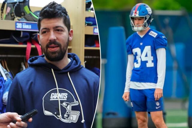 O novato não draftado Dominic Zvada abre a competição de Dominic Zvada com uniforme nº 34 do New York Giants com capacete em um campo de treino.