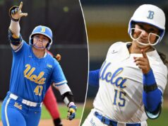 O softball da UCLA, classificado em 8º lugar, abrirá o torneio da NCAA em casa Uma jogadora de softball da UCLA, uniformizada com capacete azul e protetor de queixo branco, levanta a mão direita e aponta.