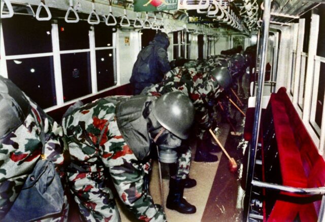 Members of the Japan Ground Self-Defense Forces clean up subway cars on March 20, 1995, in Tokyo after Aum Shinrikyo's sarin nerve gas attack.