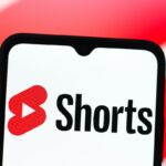 In this photo illustration, the YouTube Shorts logo is seen displayed on a smartphone screen.